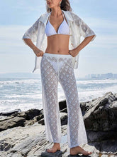 Pantalones casuales de pierna ancha con bolsillos laterales y punto calado